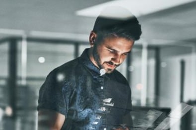 Businessman working overtime in corporate office - Image