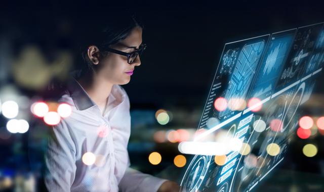Businesswoman working in digital at night - Image-1